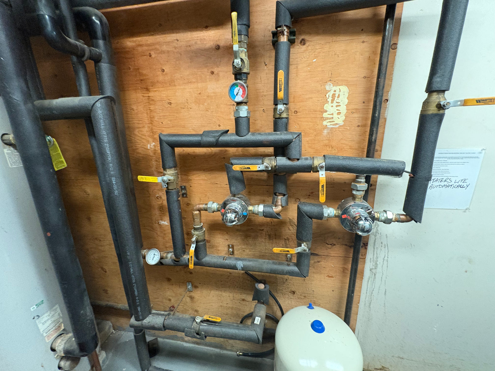 Hot water mixing valve station in a commercial mechanical room by Hassig Companies, Macomb County MI
