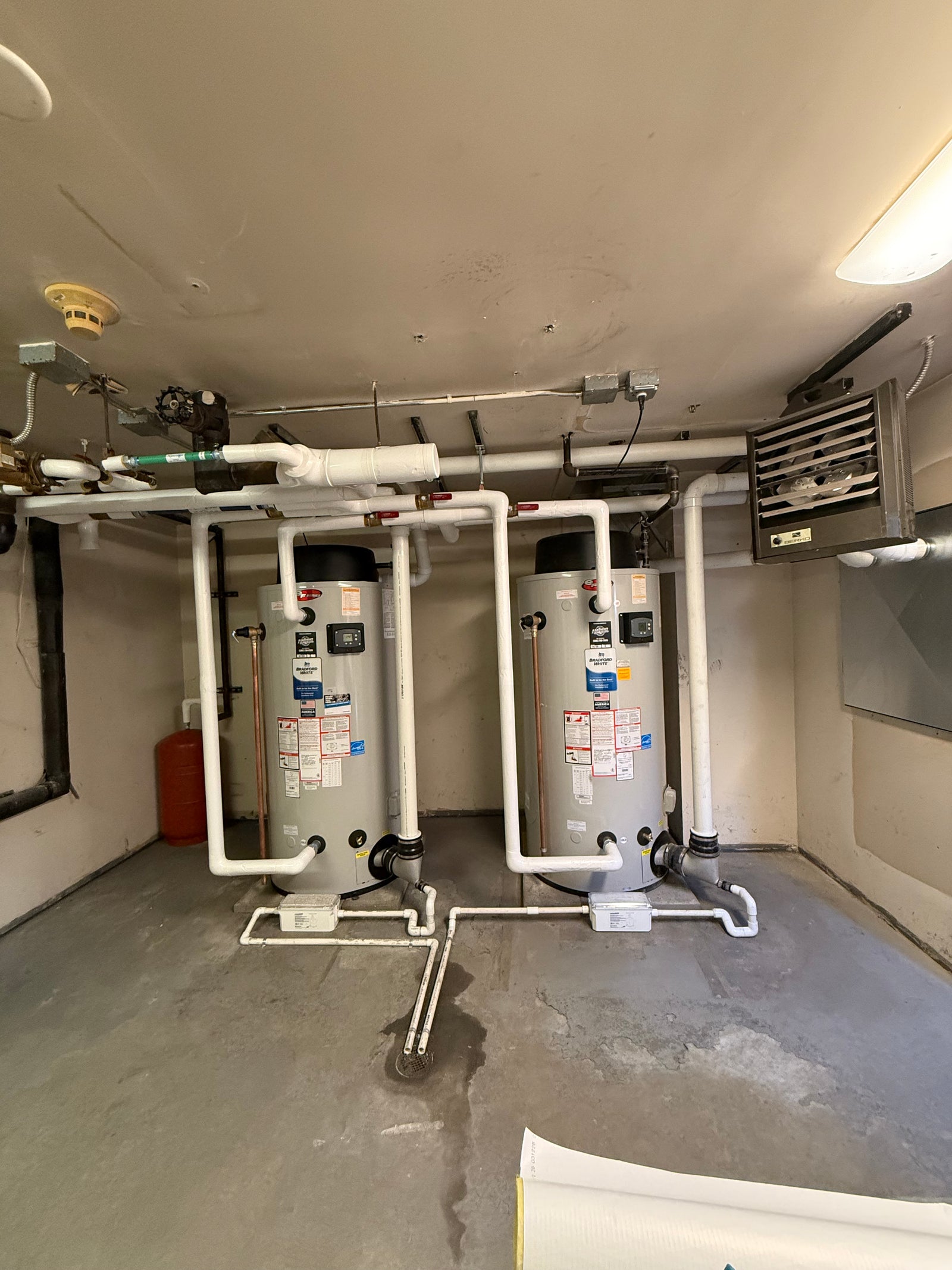 Twin commercial water heaters with PVC venting by Hassig Companies, Macomb County MI